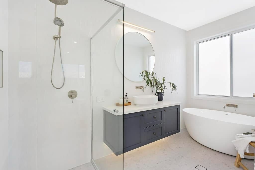 A Bathroom with A Bathtub, Sink, Shower and Mirror — Evolution Building Group Dapto, NSW
