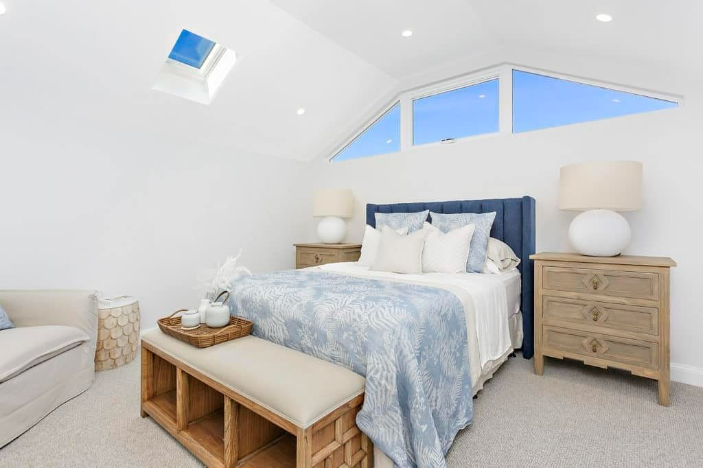 A Bedroom with A Bed, Nightstands, a Bench and A Skylight — Evolution Building Group Dapto, NSW