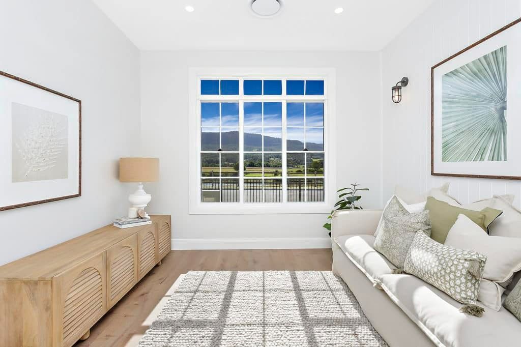 A Living Room with A Couch and A Large Window — Evolution Building Group Dapto, NSW