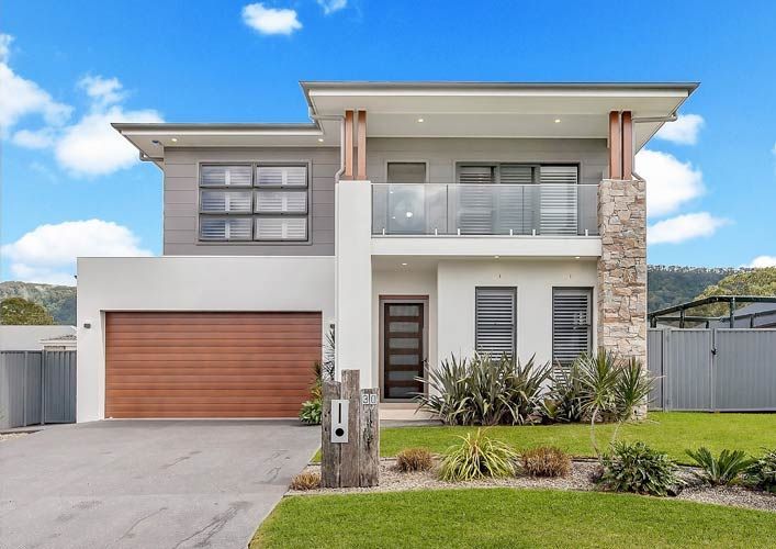 A Modern House with A Large Garage and A Balcony — Evolution Building Group Dapto, NSW