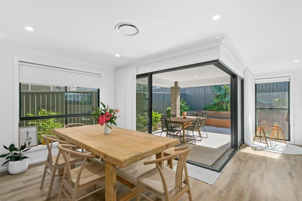 A Dining Room with A Wooden Table and Chairs — Evolution Building Group Dapto, NSW