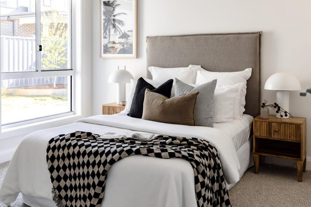 A Bedroom with A Bed, Nightstand, Lamp and Window — Evolution Building Group Dapto, NSW