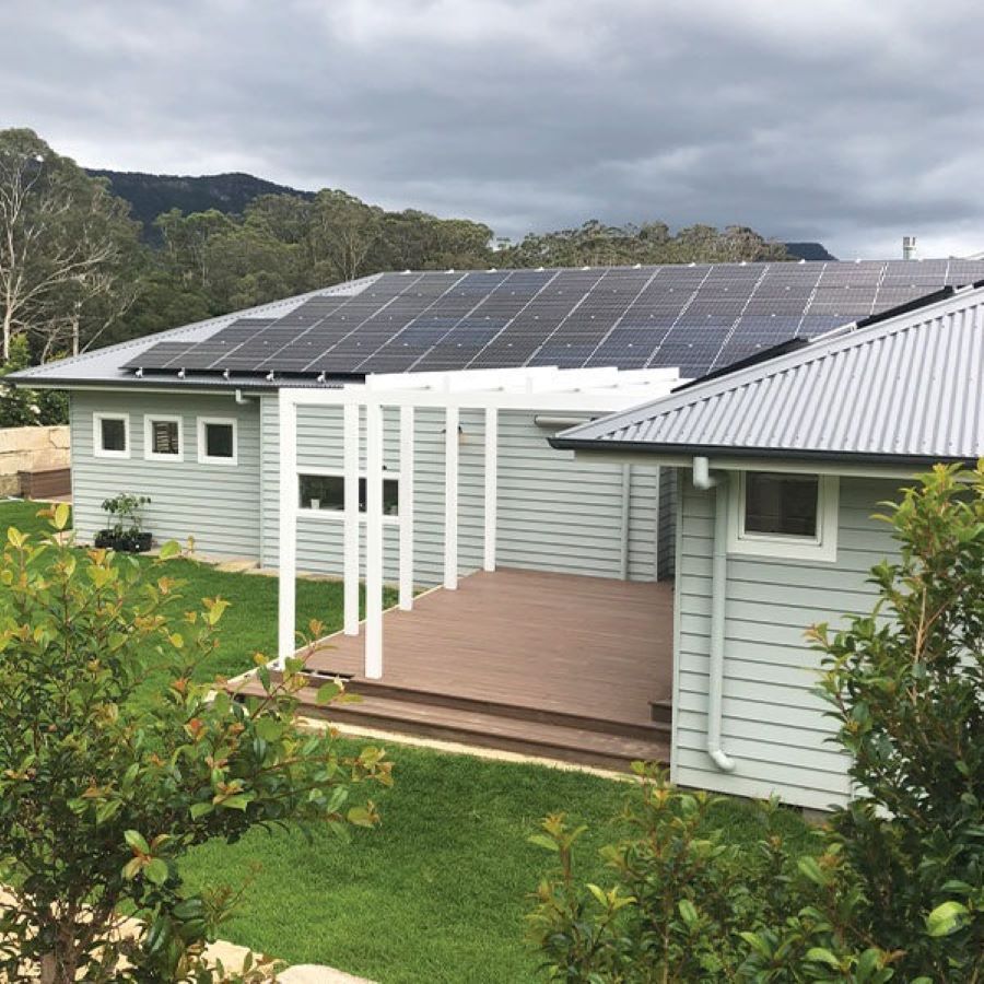 A House with A Lot of Solar Panels on The Roof — Evolution Building Group Dapto, NSW