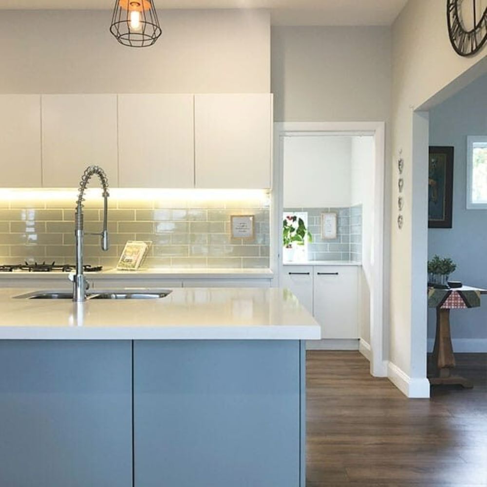 A Kitchen with A Large Island and A Sink — Evolution Building Group Dapto, NSW
