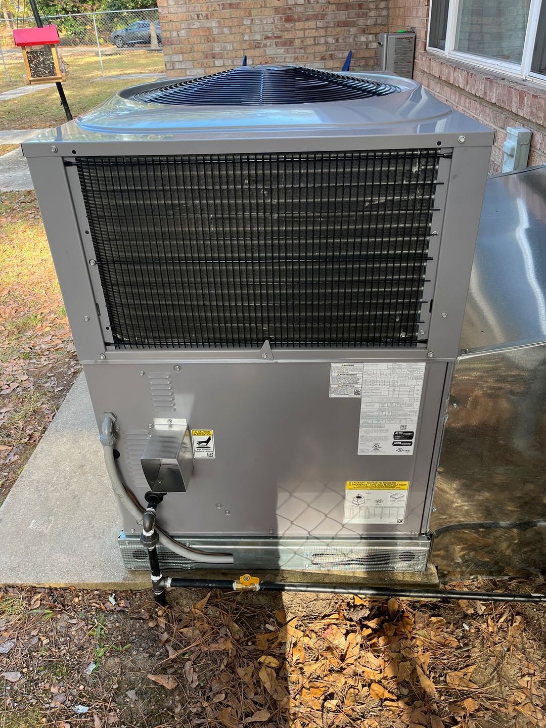 A technician inspecting a furnace