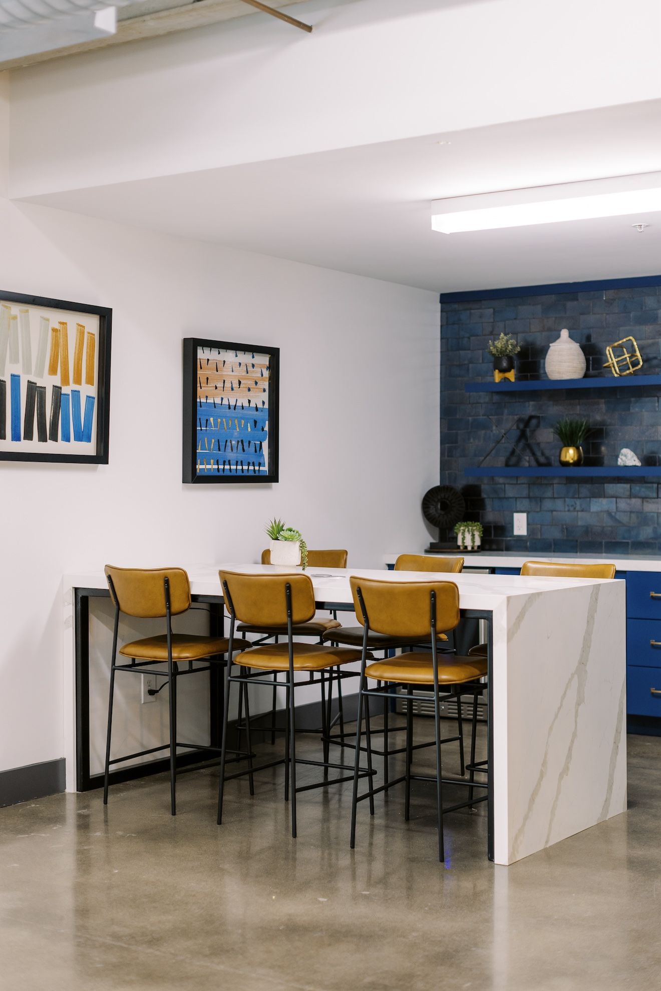 A kitchen with a table and chairs in it