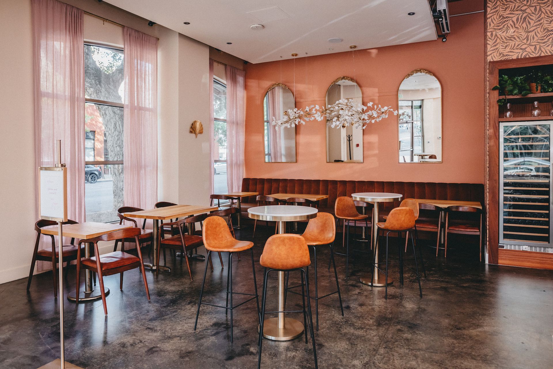 A restaurant with tables and chairs
