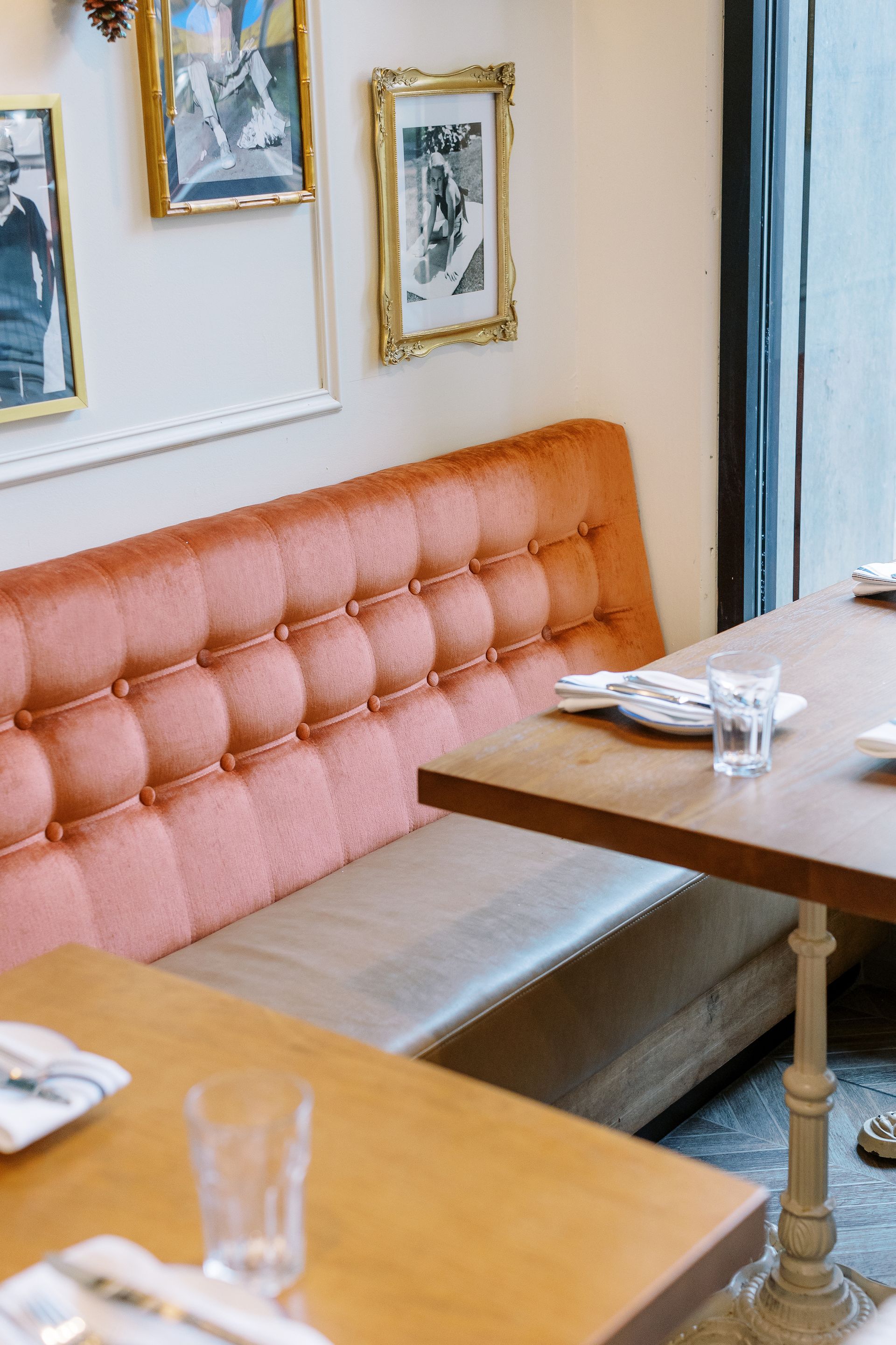 A table in a restaurant with plates and glasses on it
