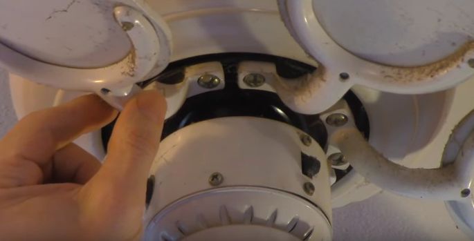 Remove the blades from a fan caked with grease.