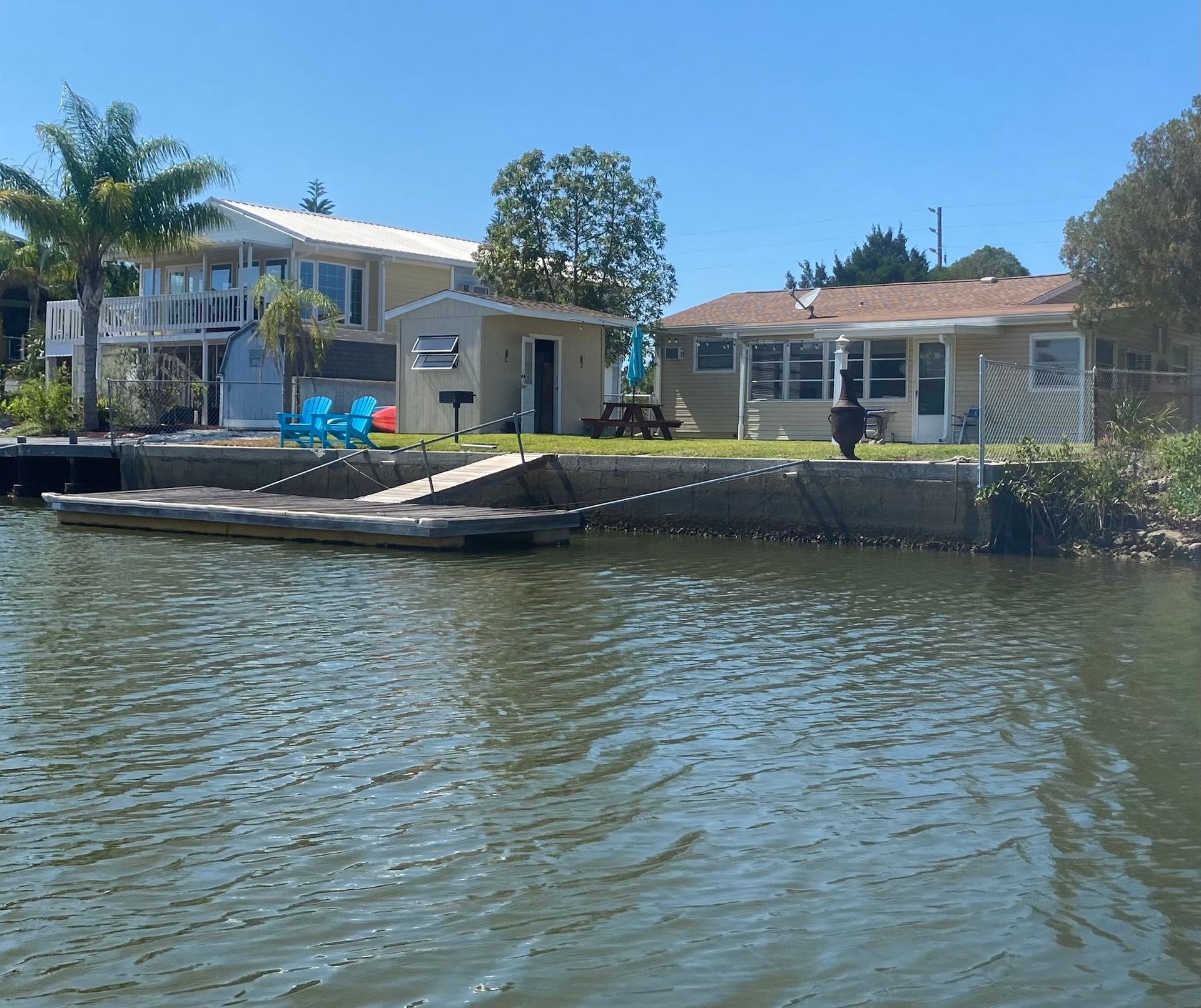 A house sits on the shore of a body of water