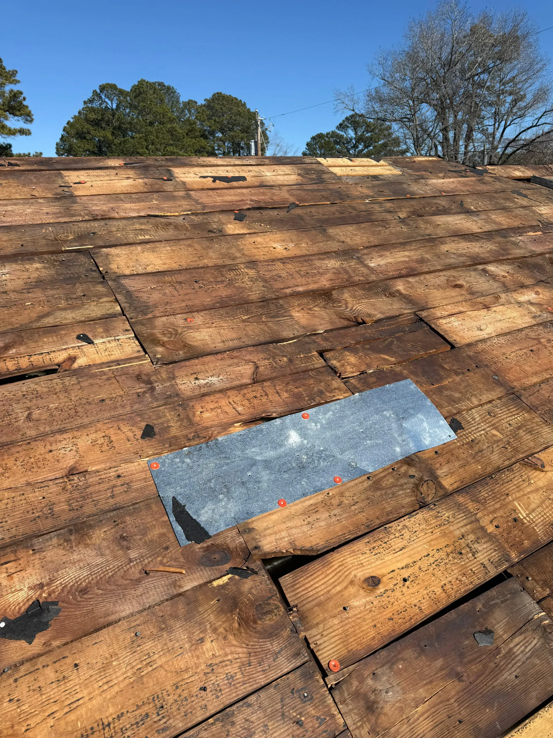 Roof Pro NC fixing missing shingles on a home in New Bern, North Carolina