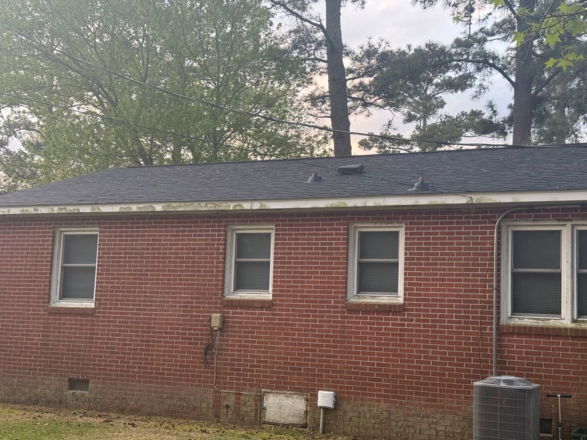 Damaged roof restored by Roof Pro NC to protect a home in New Bern, NC