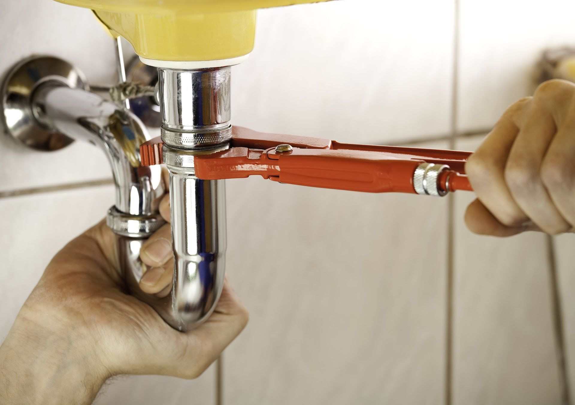 Plumber Fixing a Sink — Missouri City, TX — Britton WaterWorks Plumbing, LLC