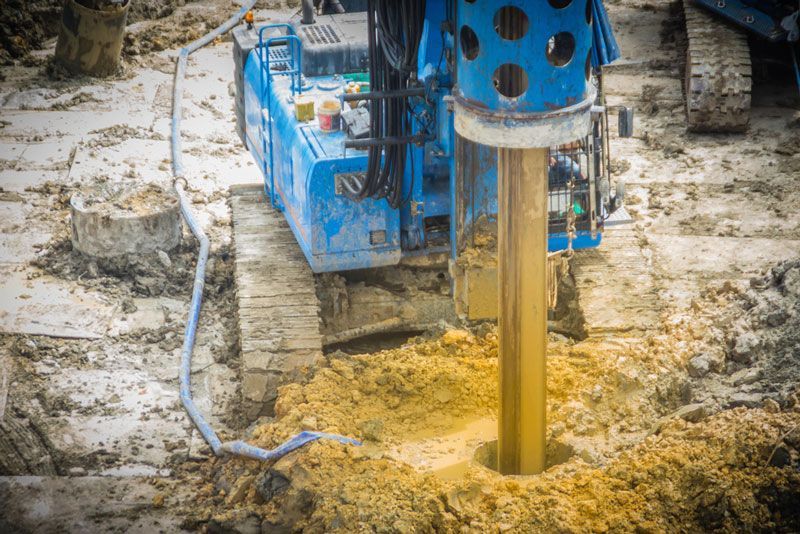 A machine is drilling a hole in the ground — Hydro Excavation in Narellan, NSW