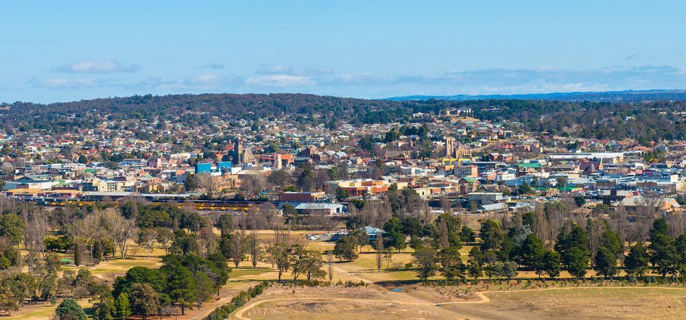An aerial view of a city surrounded by trees and a field — Hydro Excavation in Goulburn, NSW