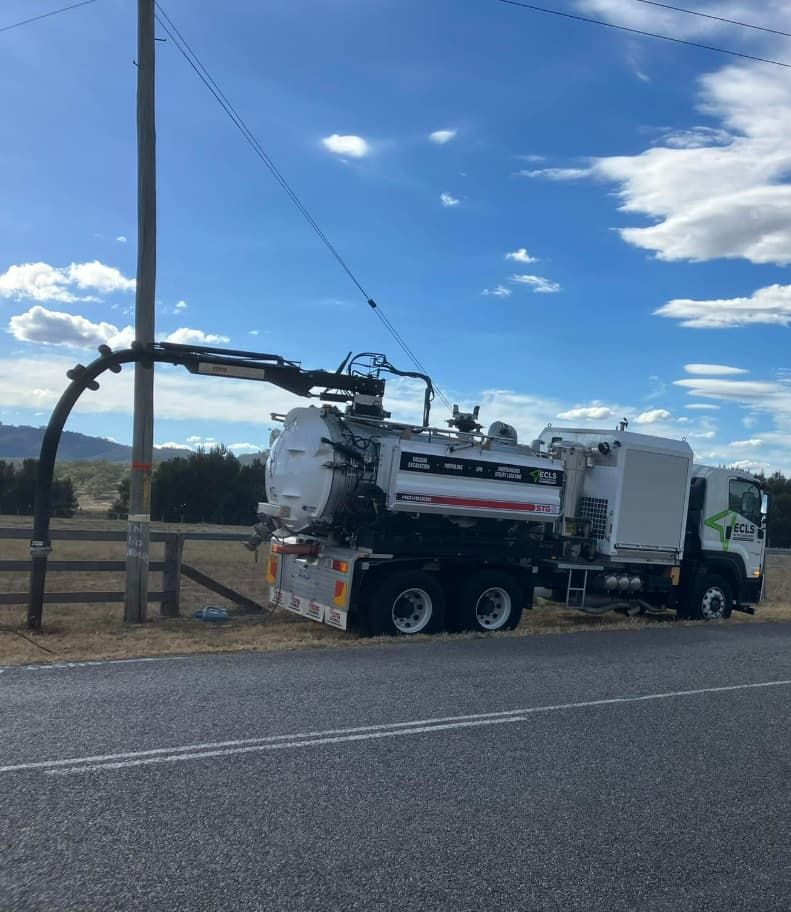 A Vacuum Truck Is Parked On The Side Of The Road — East Coast Locating Services In Mid North Coast, NSW