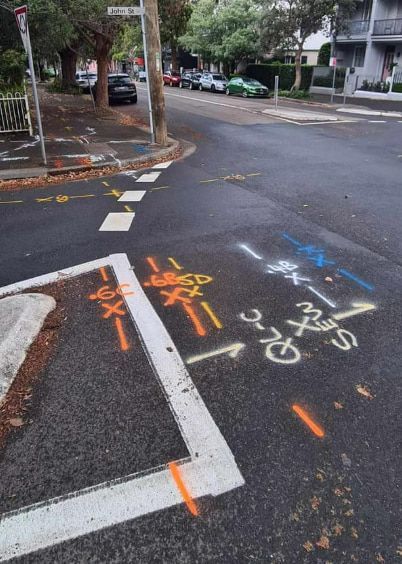 A Corner Of A Street With Graffiti On It — East Coast Locating Services In Port Stephens, NSW