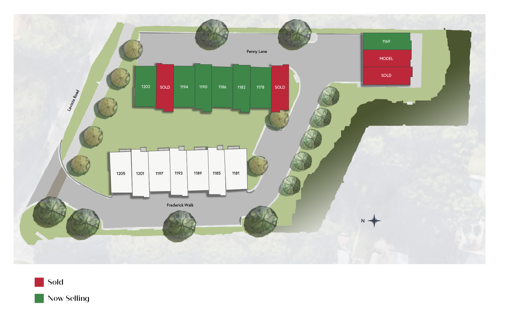A site plan showing two rows of rectangular building footprints and a small separate structure, set among green trees.