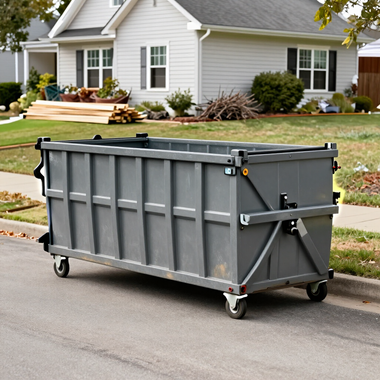 Large gray construction dumpster on a suburban street in front of a house