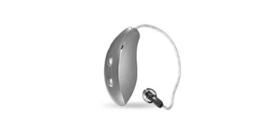 Gray behind-the-ear hearing aid with a clear tube and earpiece on a white background