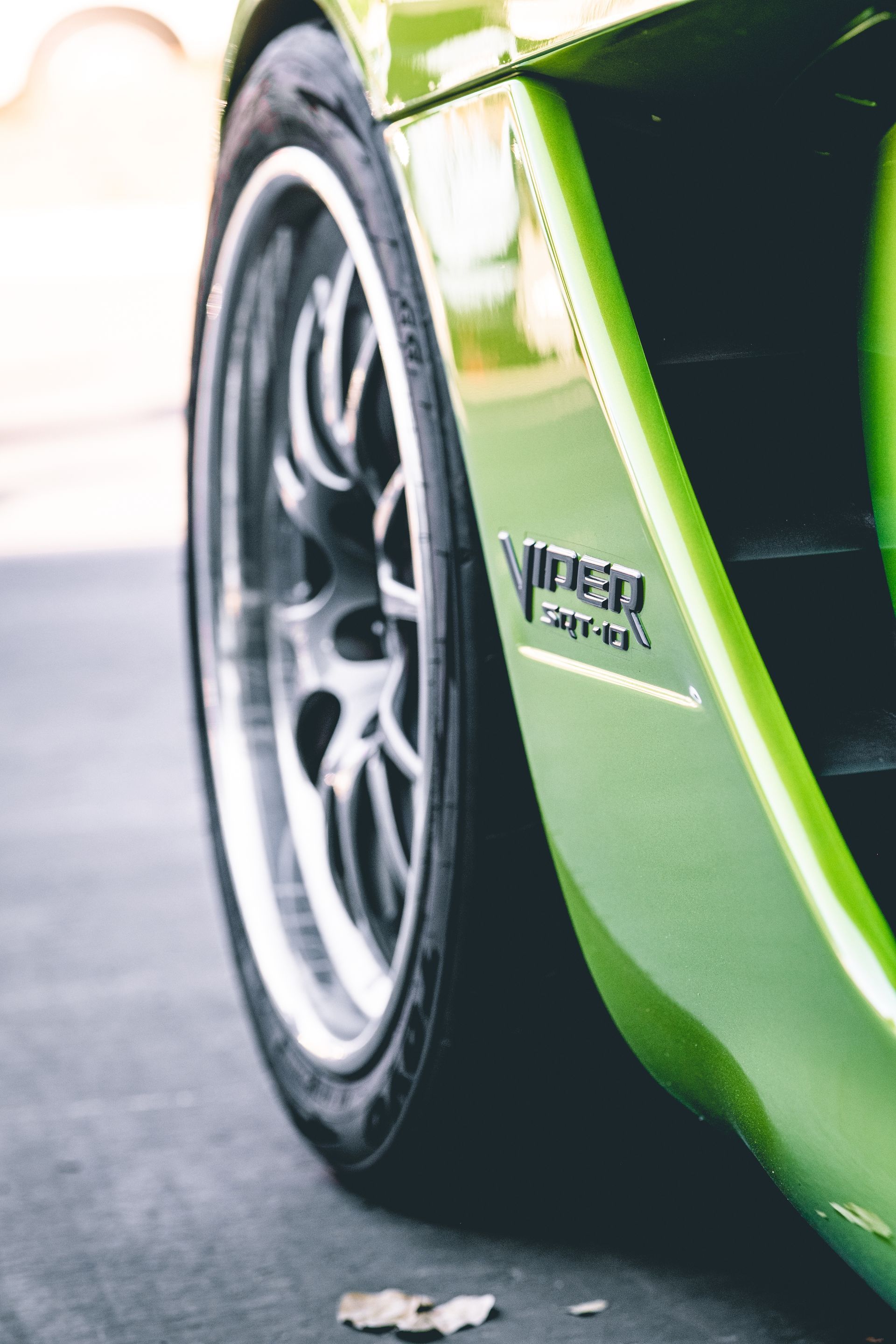 polished white dodge viper in a garage