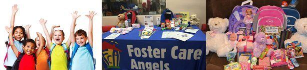 Children with raised hands beside a table of donated toys and a