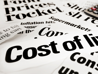 A close up of a newspaper article about cost of living