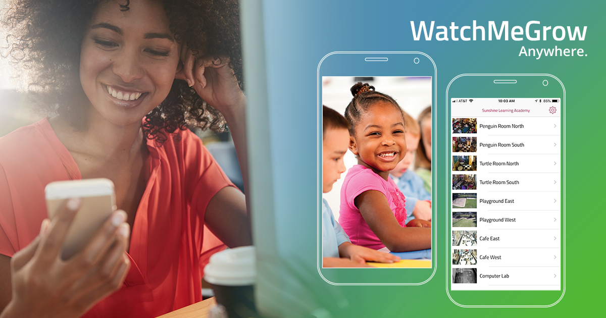 Woman smiles, looks at phone; app on phone shows child smiling. 