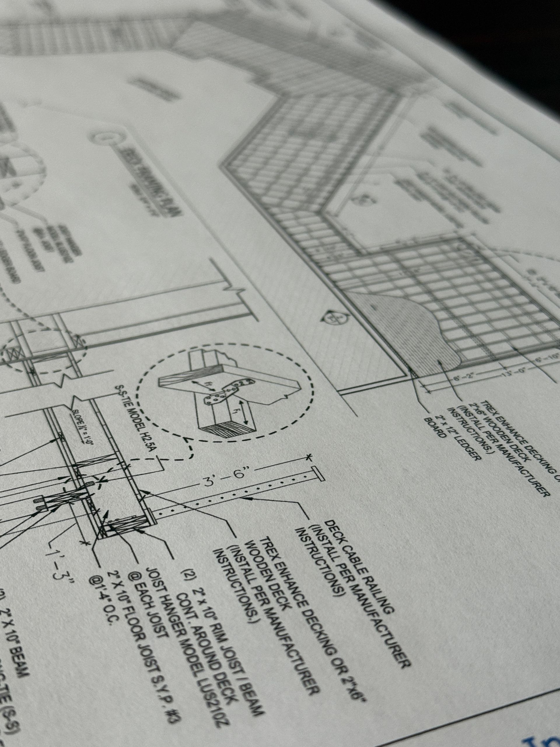 Architectural blueprints for a building project. Detailed line drawings show construction elements and annotations.