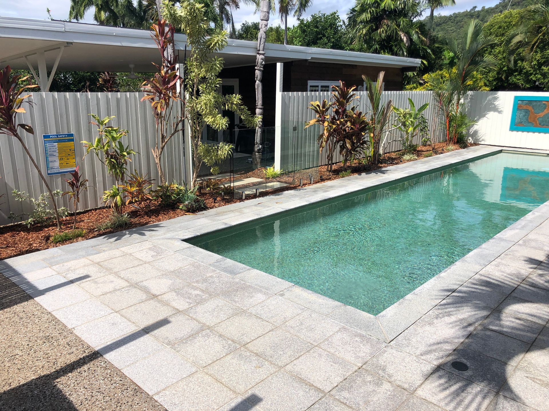 Natural stone pavers installed to pool area