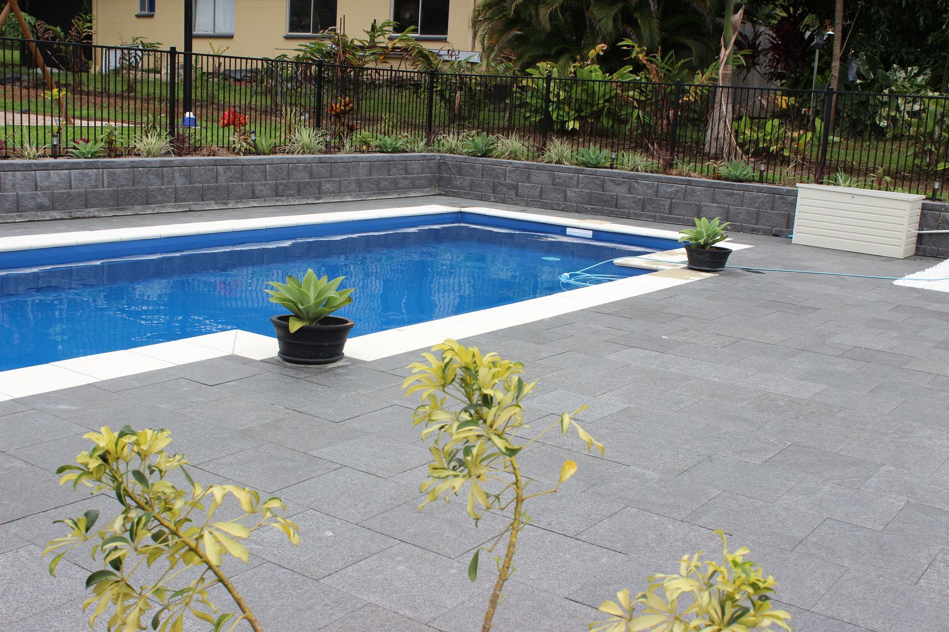 Austral Hastings retaining wall and natural stone pavers to pool area
