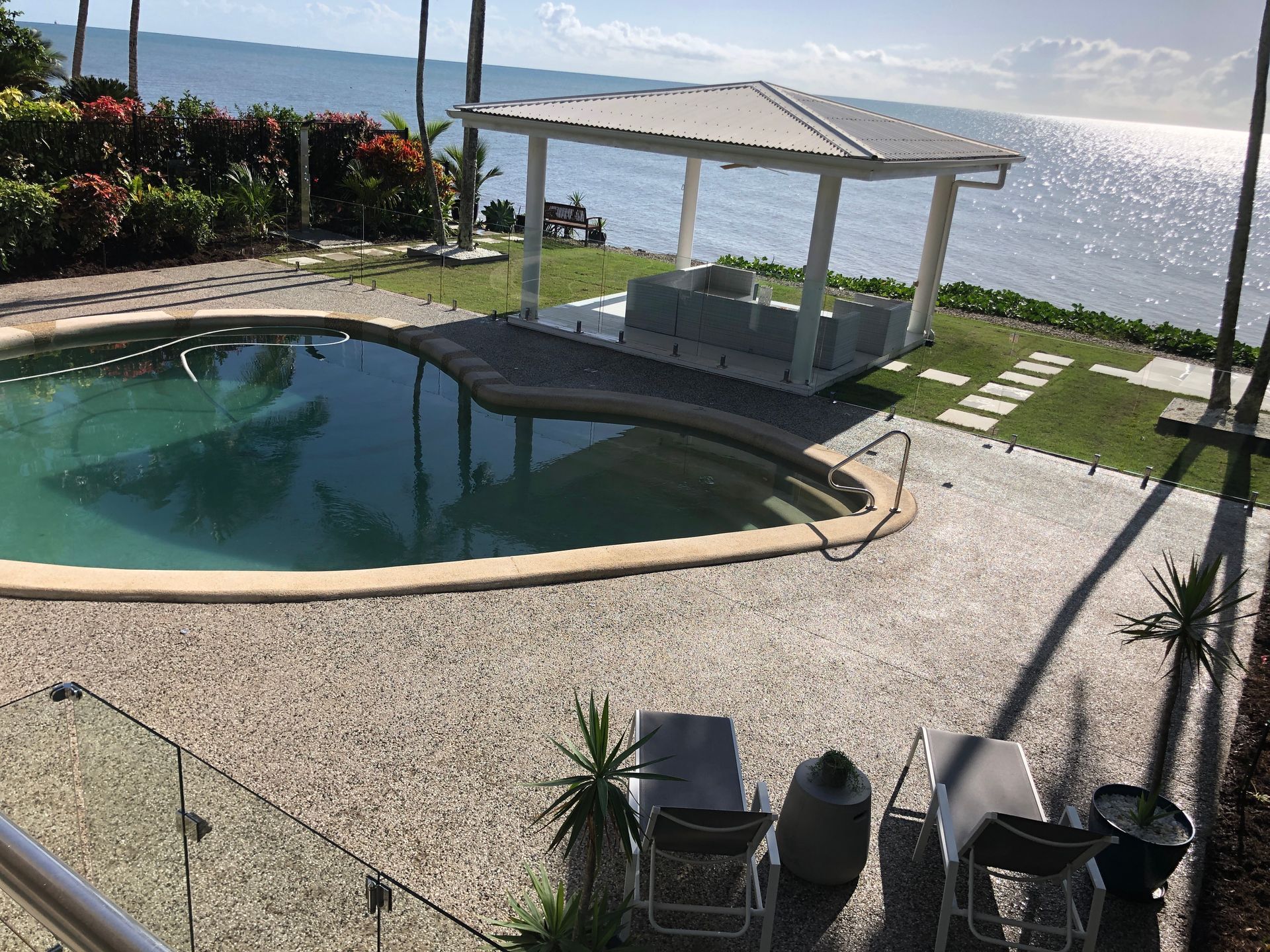 Exposed aggregate concrete to pool and gazebo areas installed