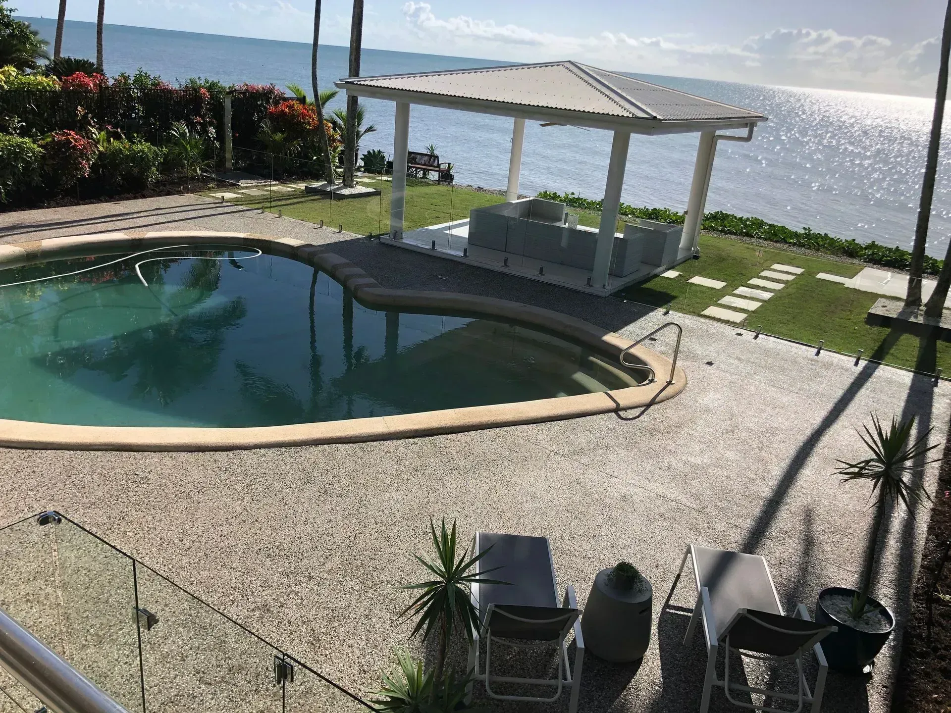 Exposed aggregate concrete around a Cairns pool