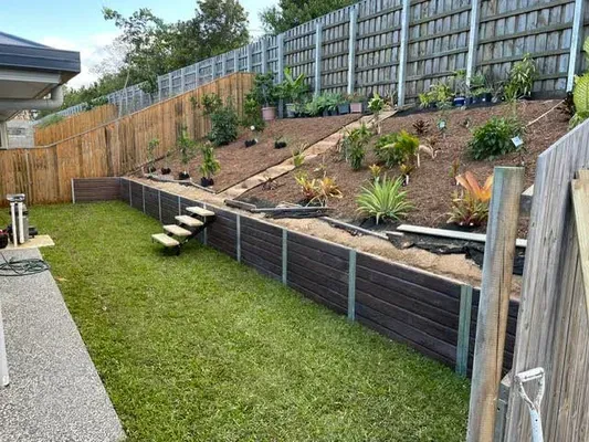 Retaining wall blocks used to support a landscaped sloping backyard in Cairns