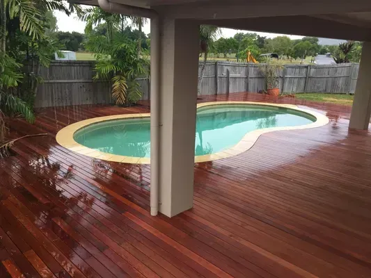 Exposed concrete driveway beside a Cairns home