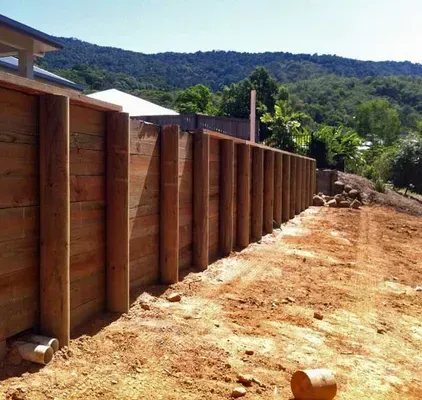 Timber sleeper retaining wall on a sloping residential property in Cairns