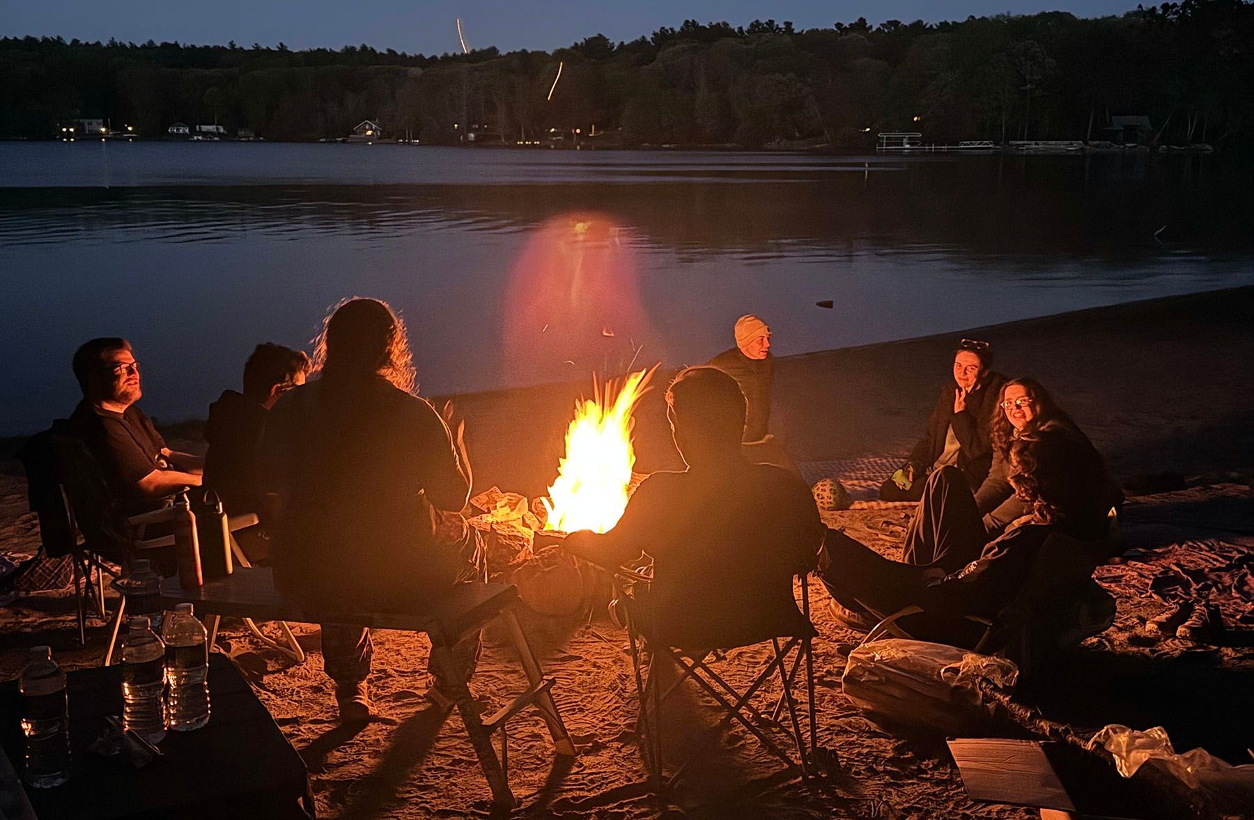 House residents gathered around a campfire at their retreat this past weekend.