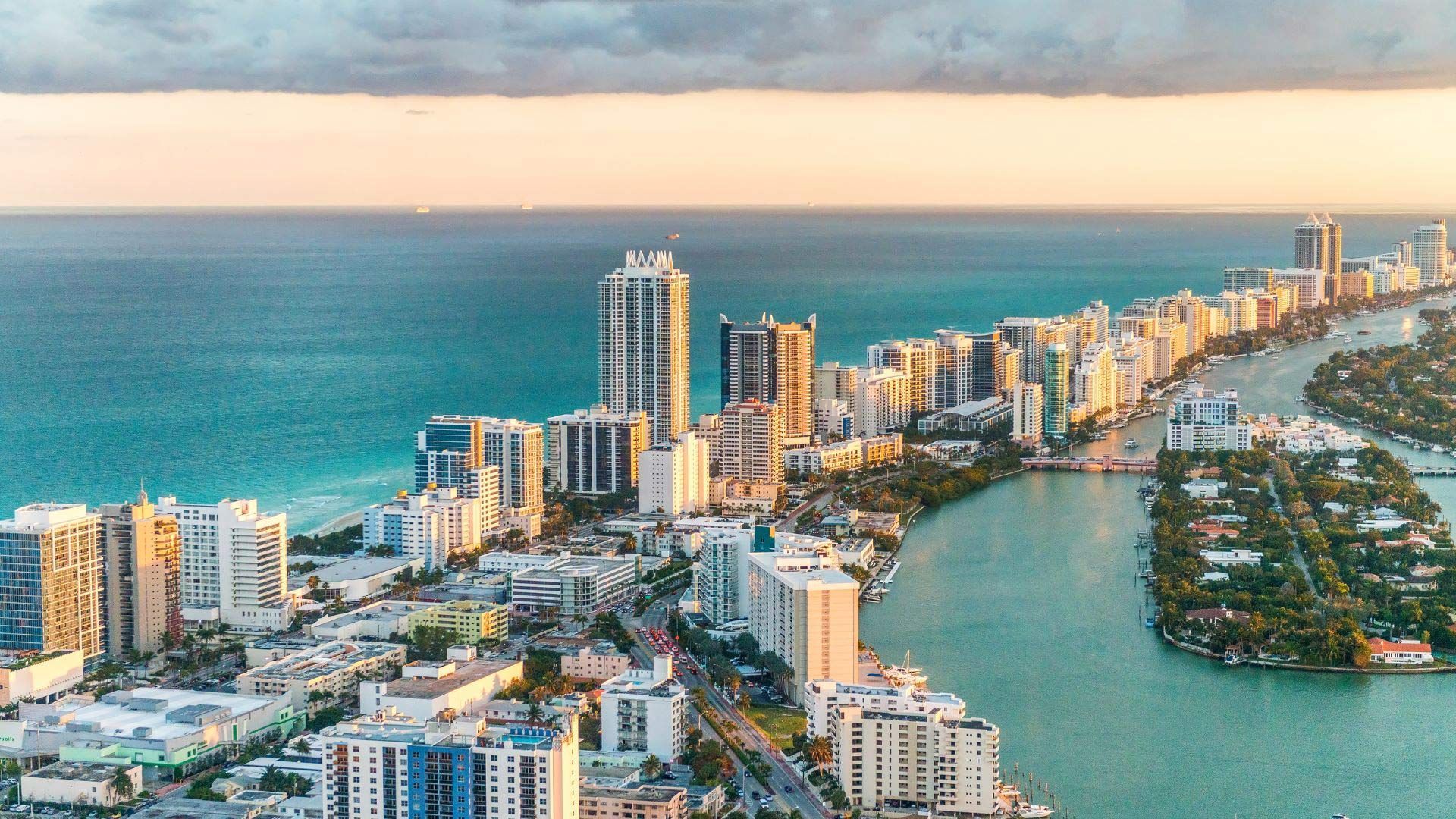 An aerial view of a city next to a body of water.