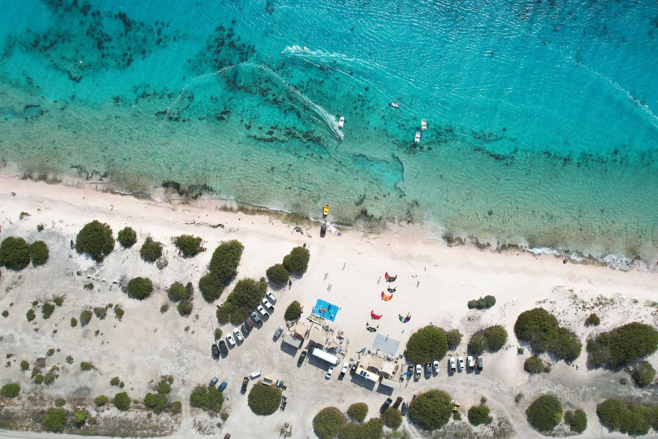 An aerial view of a beach with boats in the water in Bonaire