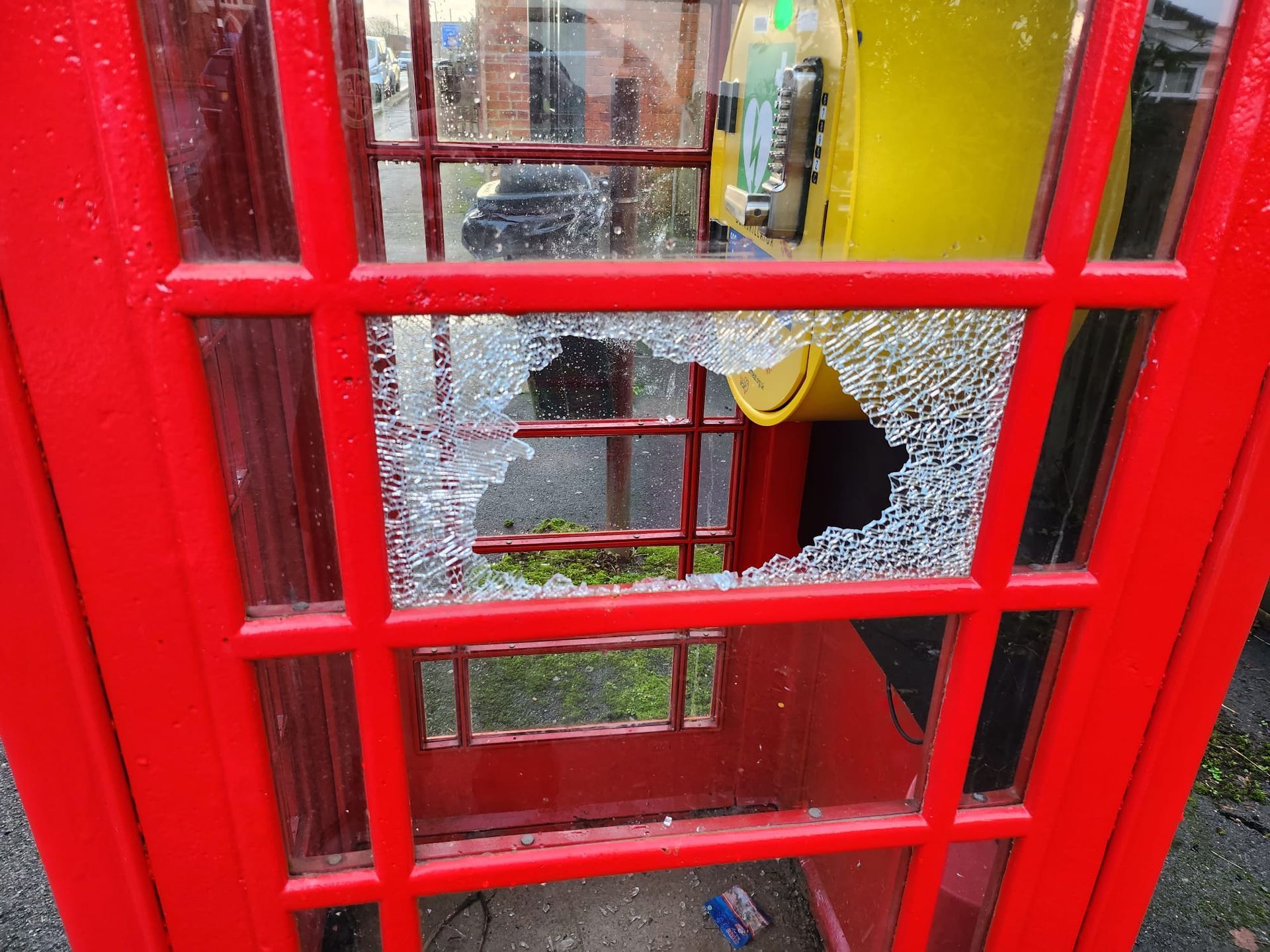 Broken window at the phone box in Newton Broken window at the phone box in Newton