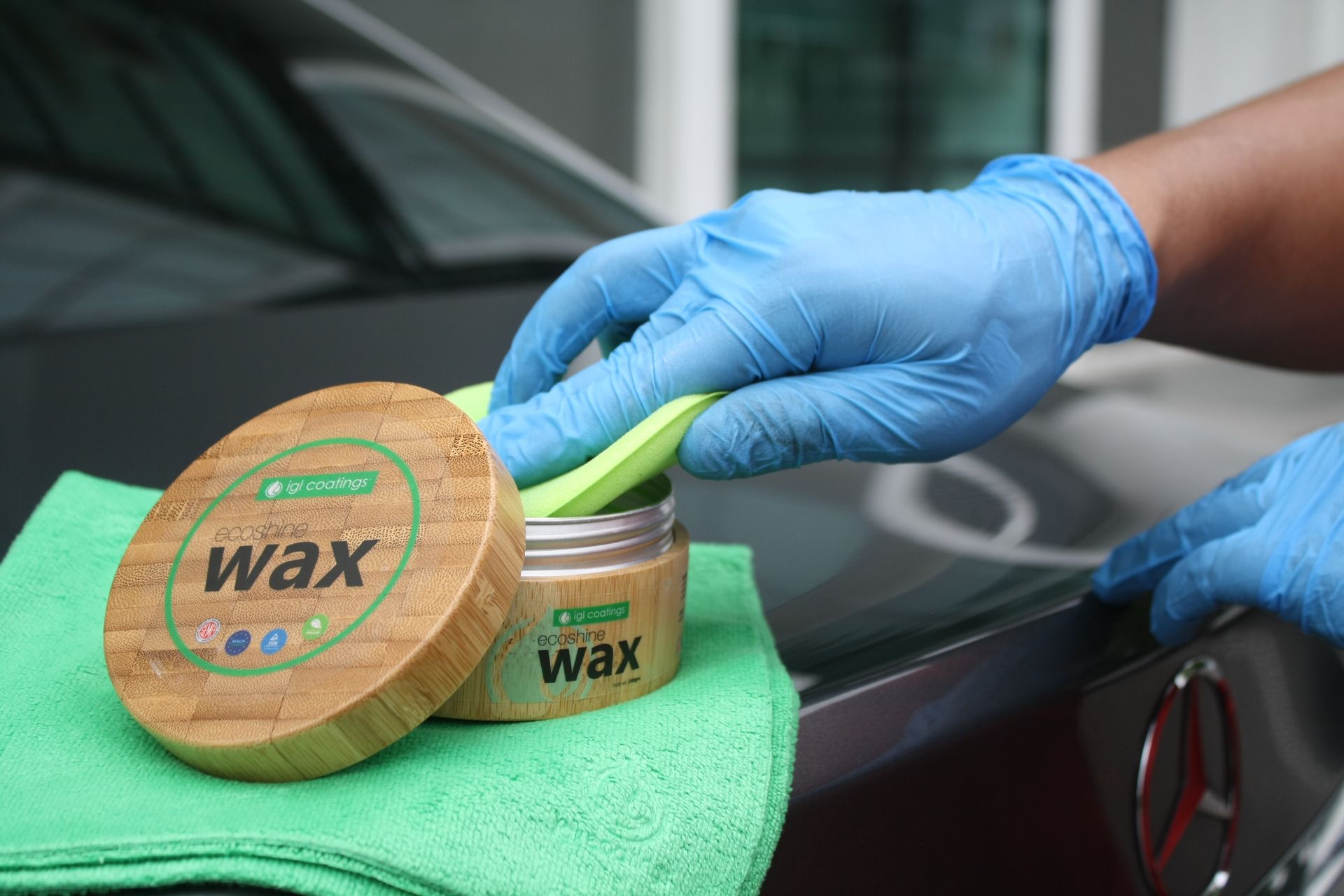 Traditional paste wax being applied to a car