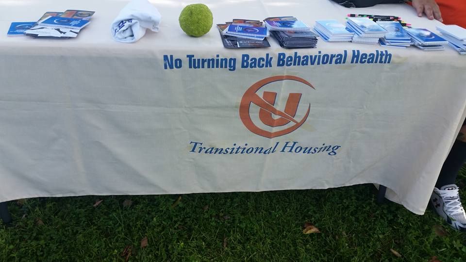A table with a sign that says no turning back behavioral health