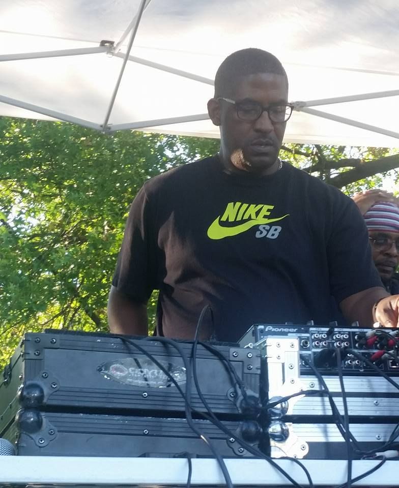 A man wearing a black nike sb shirt