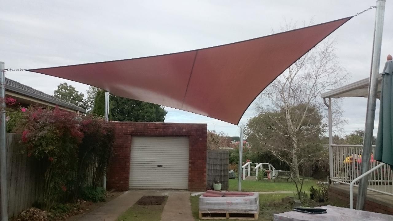 Commercial shade sail installation for domestic customer in Lyndhurst Melbourne for a carport for sun protection including large steel poles 