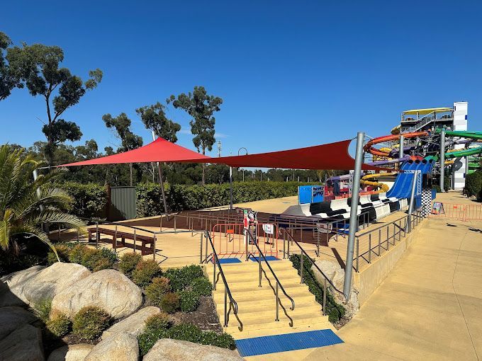 Shade Sail Installation in front of the water slide ride at Gumbuya World Theme Park  | 2705 Princes Hwy, Tynong North VIC 3813 Melbourne | Sundance Shade Structures PTY LTD 