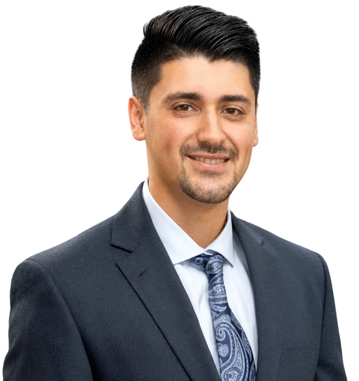 A man in a suit and tie is smiling for the camera.