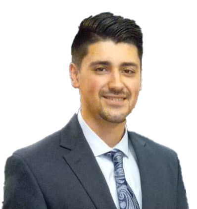 A man in a suit and tie is smiling for the camera.