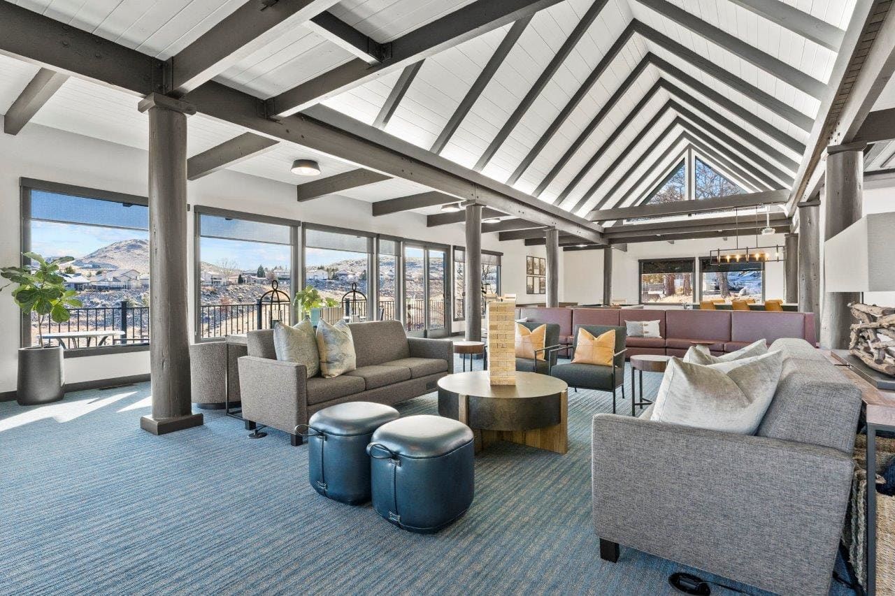 Ascent On Steamboat living room filled with furniture and a vaulted ceiling.