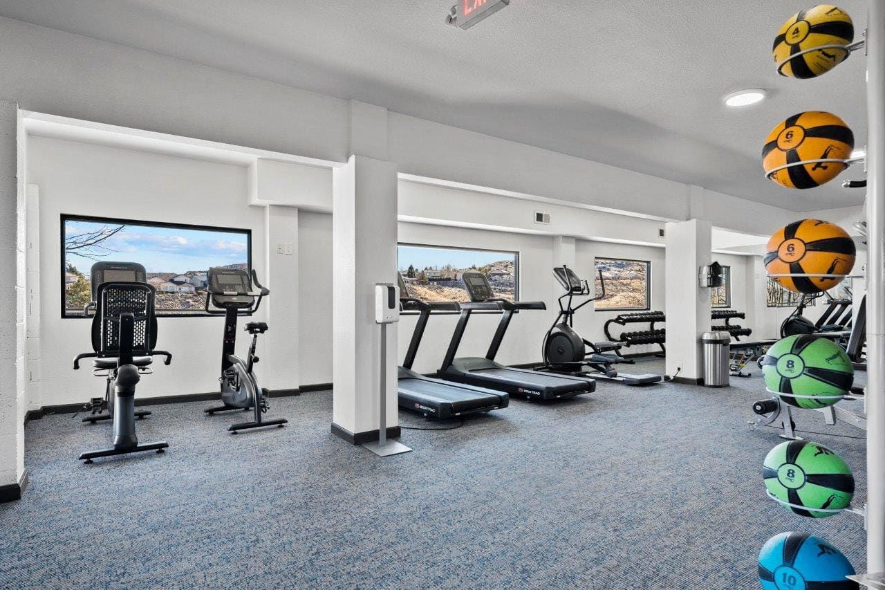 Ascent On Steamboat gym with treadmills , exercise bikes , and soccer balls.