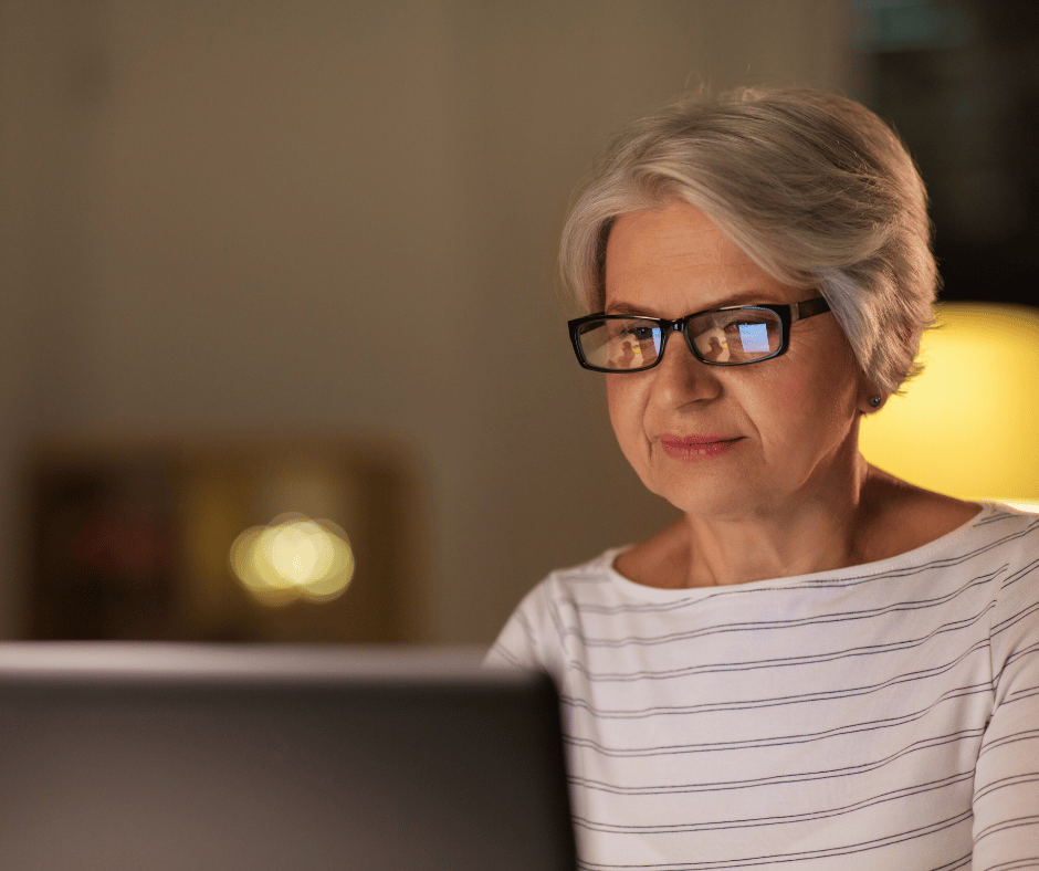 A woman on her computer comparing the differences between Medigap and Medicare Advantage plans.